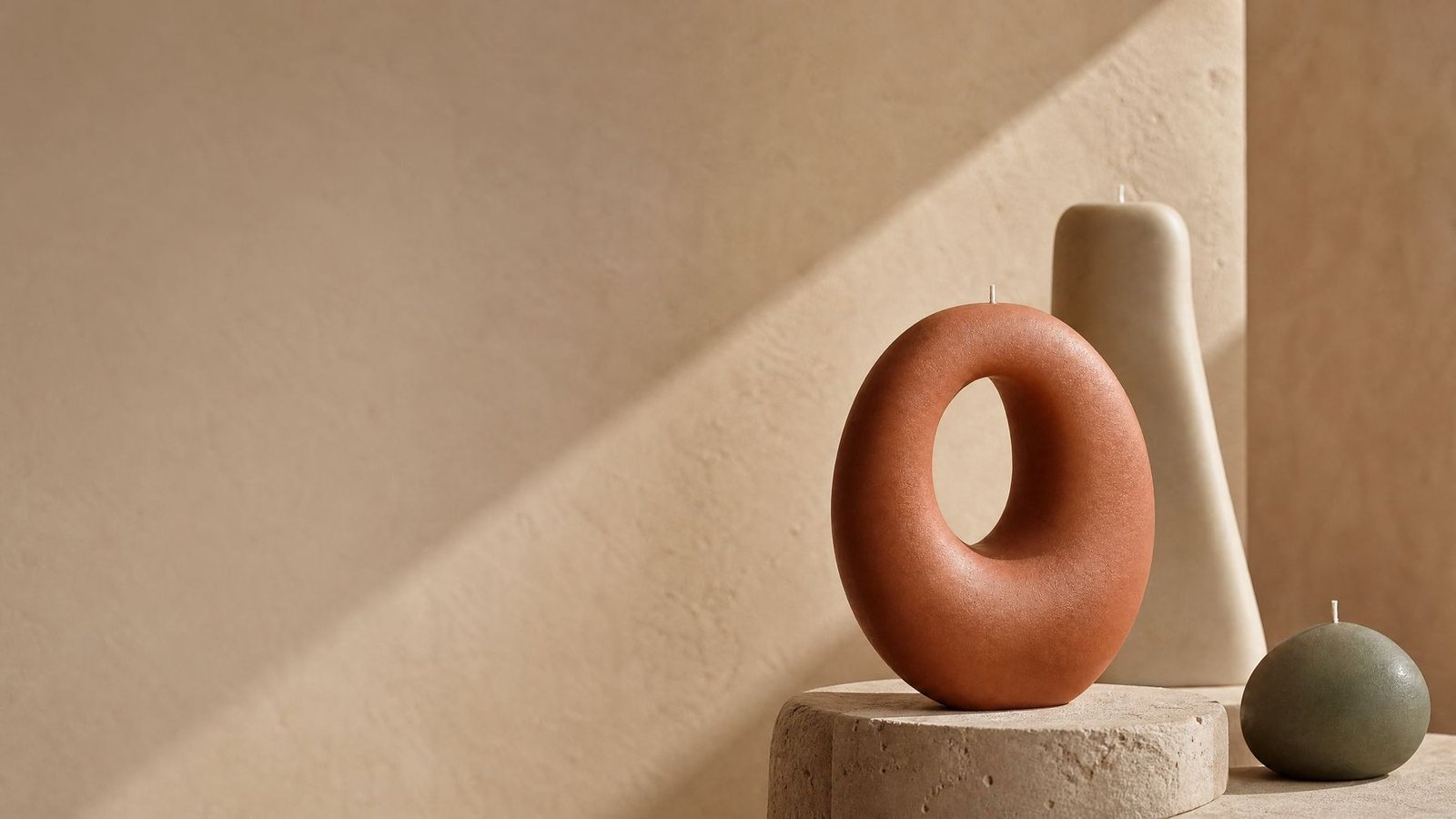 Homey sculptural candles in warm afternoon light