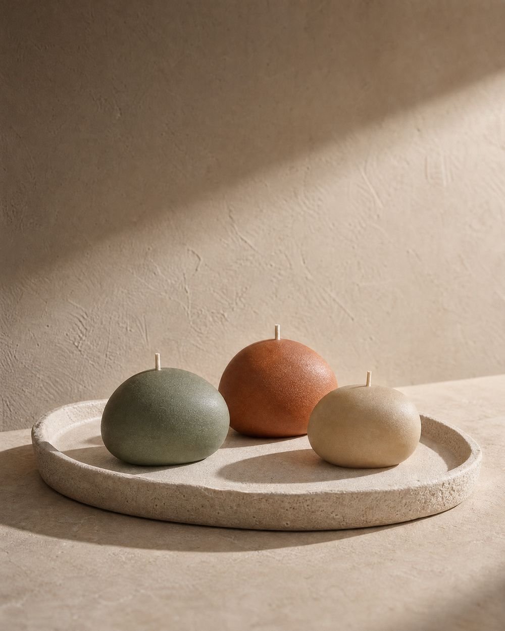 The Little Ritual, three small sculptural candles in cream, terracotta and sage
